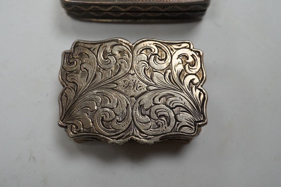 A late George III silver rectangular vinaigrette, John Thropp, Birmingham, 1819, 39mm and one other foliate scroll engraved silver vinaigrette, Birmingham, 1845. Condition - poor to fair